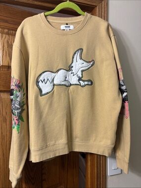 Akoo Tan Crewneck Sweatshirt with White Fox Patch and Multicolor Sleeve Graphics